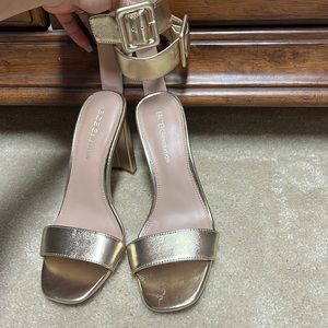 Never worn out of home gold BCBG heels